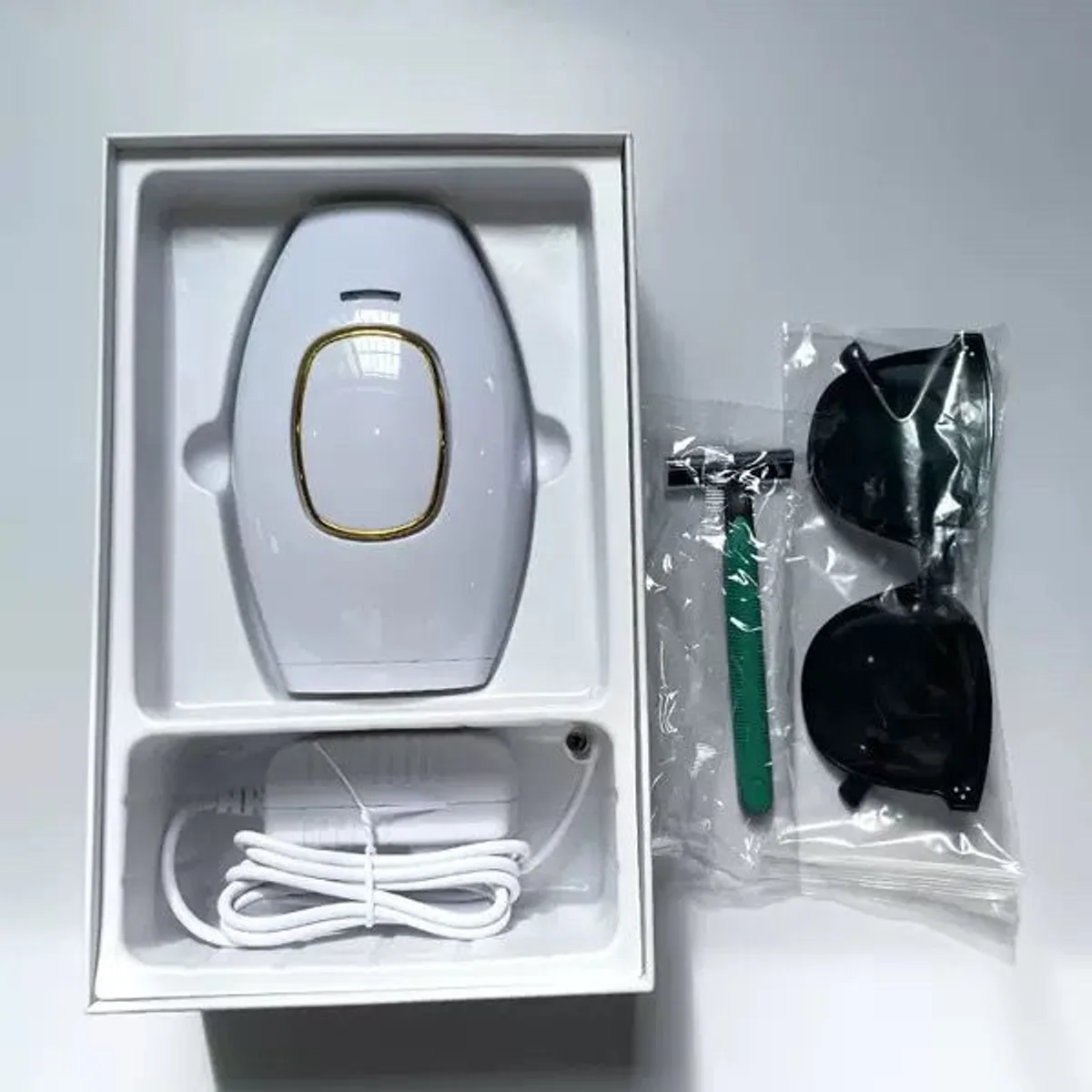 IPL handset in its box with glasses and razor